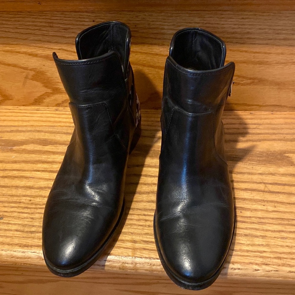 Michael Kors Black booties with cow skin design size 5.5. Worn a few times.